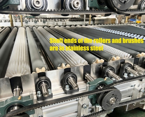 Stainless steel roller and brush shaft ends on the Techwin TWQX-1200K-3 horizontal glass washing machine