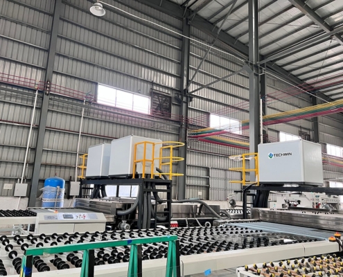 Techwin TWQX-3300G-3 jumbo horizontal glass washing machine installed in a glass processing line
