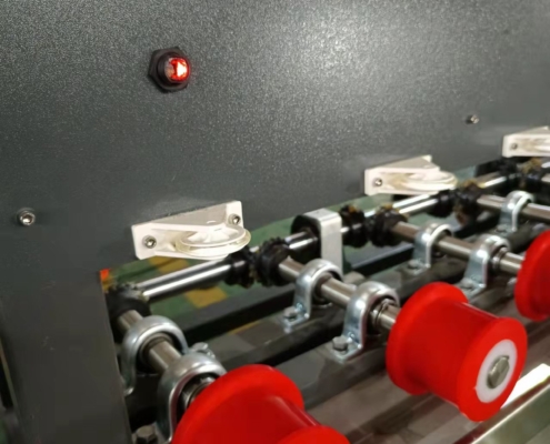 Conveyor rollers on the Techwin vertical glass washing machine